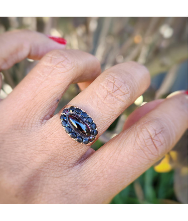 Georgian Garnet Cabochon and Jet Halo Ring in 9ct Gold Georgian Garnet Cabochon and Jet Halo Ring in 9ct Gold