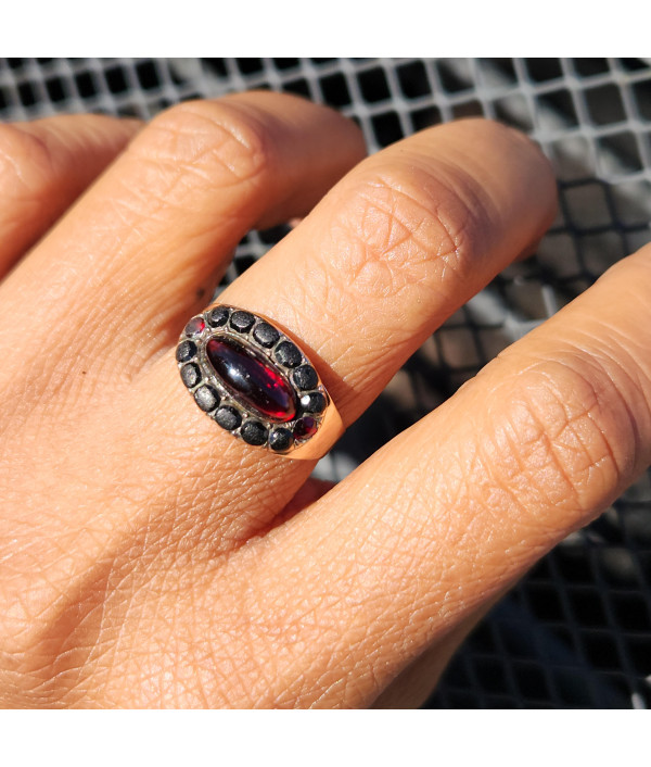 Georgian Garnet Cabochon and Jet Halo Ring in 9ct Gold Georgian Garnet Cabochon and Jet Halo Ring in 9ct Gold