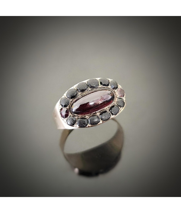 Georgian Garnet Cabochon and Jet Halo Ring in 9ct Gold Georgian Garnet Cabochon and Jet Halo Ring in 9ct Gold
