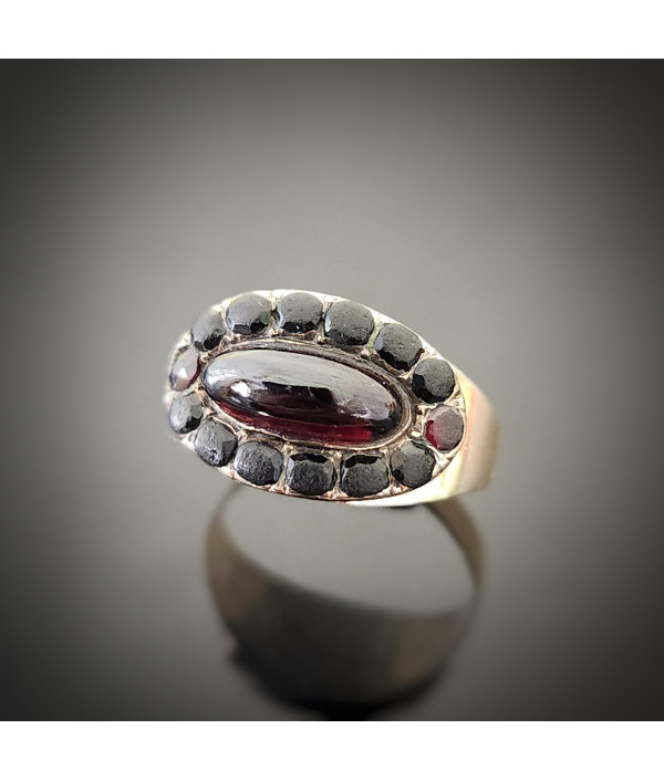 Georgian Garnet Cabochon and Jet Halo Ring in 9ct Gold Georgian Garnet Cabochon and Jet Halo Ring in 9ct Gold