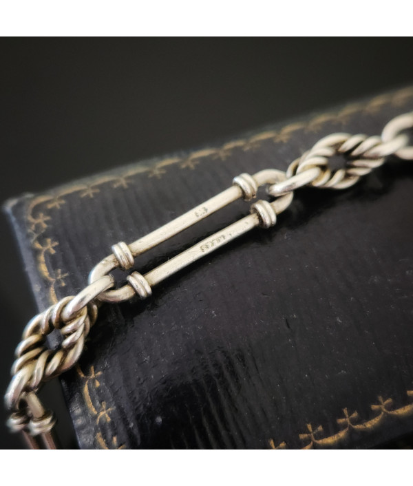 Antique Sterling Silver Trombone and Lover’s Knot Albert Chain Bracelet with Enamelled Cherub Charm Antique Sterling Silver Trombone and Lover’s Knot Albert Chain Bracelet with Enamelled Cherub Charm