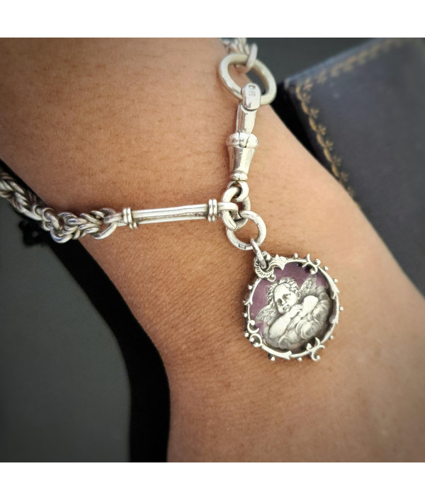 Antique Sterling Silver Trombone and Lover’s Knot Albert Chain Bracelet with Enamelled Cherub Charm Antique Sterling Silver Trombone and Lover’s Knot Albert Chain Bracelet with Enamelled Cherub Charm