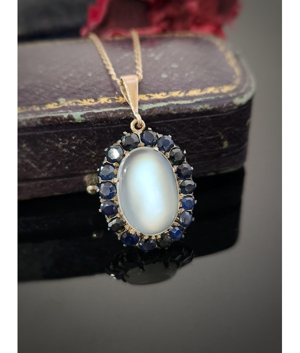 Antique Moonstone And Sapphire Halo Pendant in 9ct Gold Antique Moonstone And Sapphire Halo Pendant in 9ct Gold