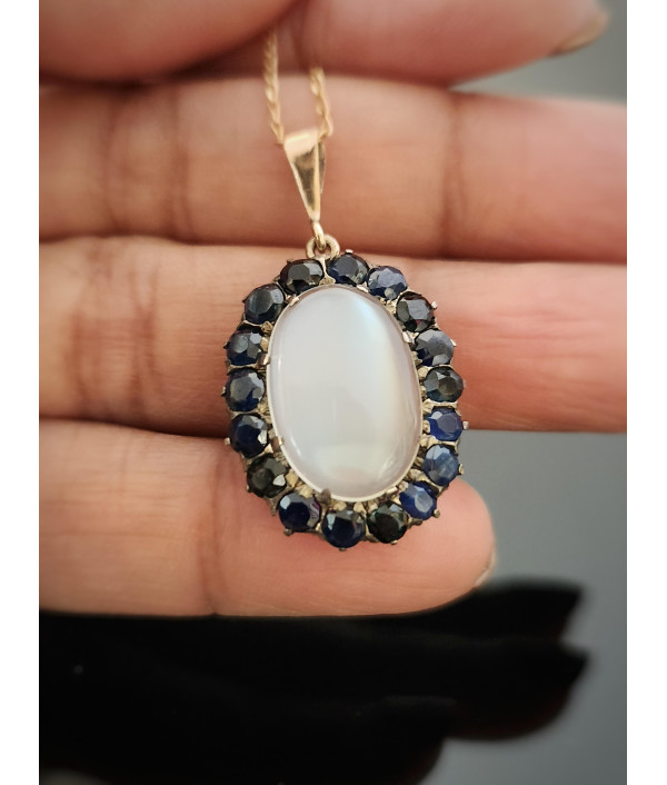 Antique Moonstone And Sapphire Halo Pendant in 9ct Gold Antique Moonstone And Sapphire Halo Pendant in 9ct Gold
