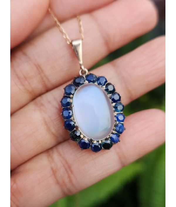 Antique Moonstone And Sapphire Halo Pendant in 9ct Gold Antique Moonstone And Sapphire Halo Pendant in 9ct Gold
