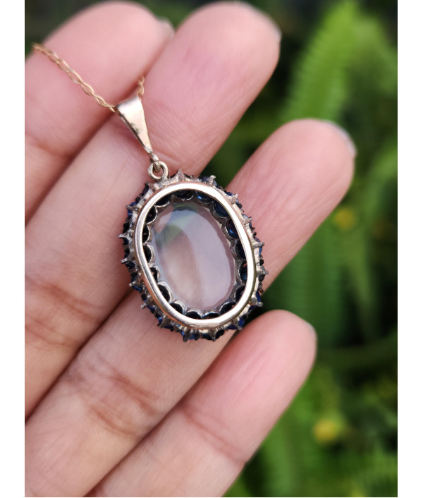 Antique Moonstone And Sapphire Halo Pendant in 9ct Gold Antique Moonstone And Sapphire Halo Pendant in 9ct Gold