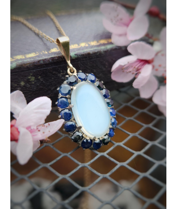 Antique Moonstone And Sapphire Halo Pendant in 9ct Gold Antique Moonstone And Sapphire Halo Pendant in 9ct Gold